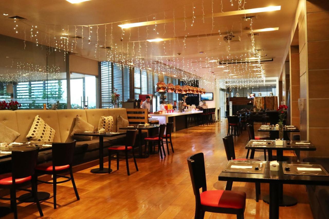 Wyndham Concepcion Pettra Hotel Buitenkant foto The interior of the restaurant